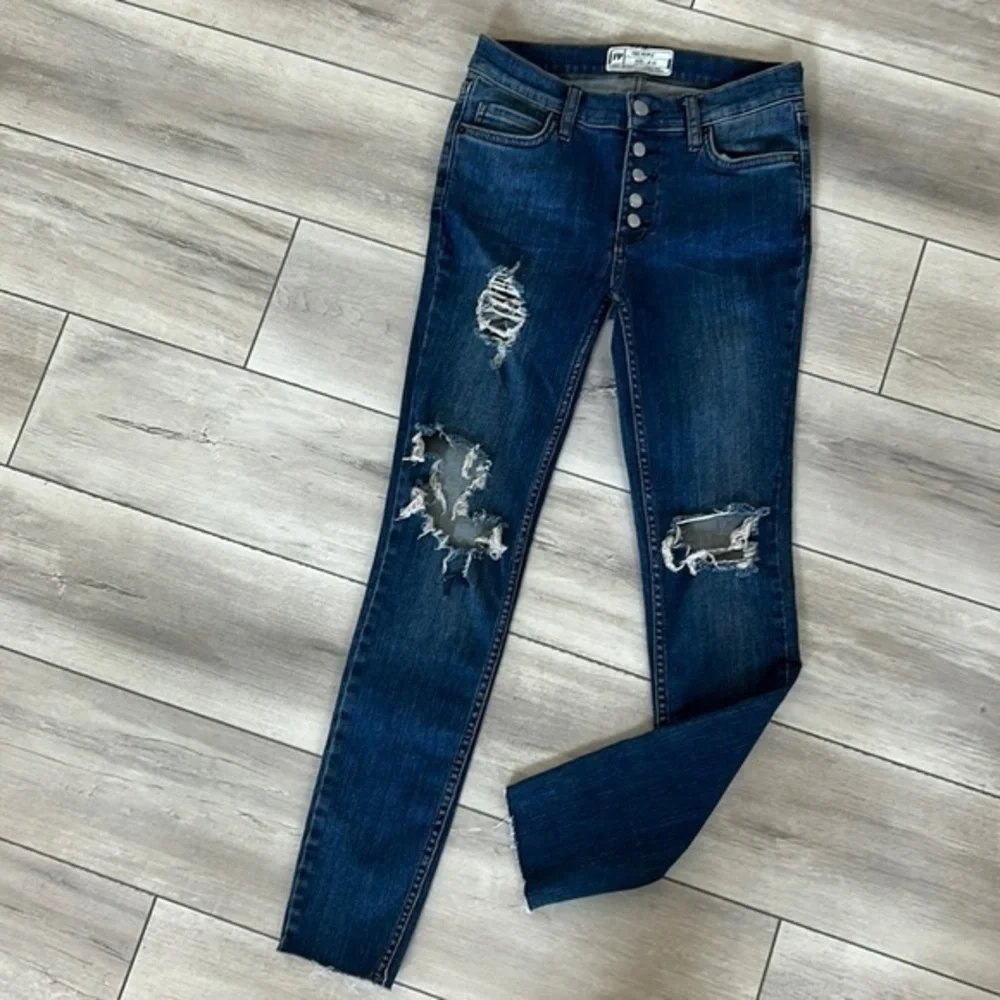 Free People size 25 busted knee button fly jeans